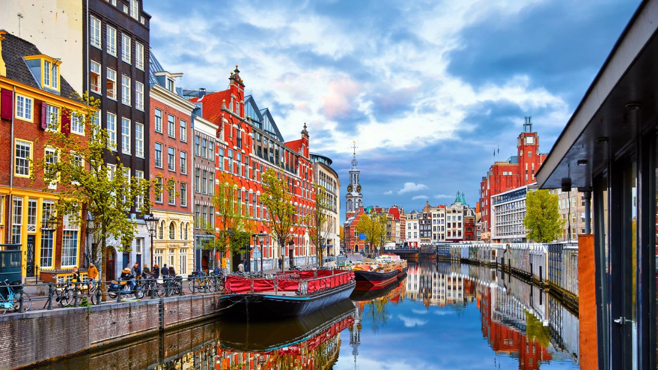 Channel in Amsterdam Netherlands houses river Amstel